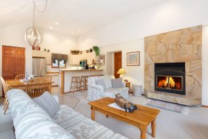 Living Area with floor to ceiling wood burning fireplace